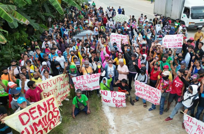 Residents of Brooke’s Point form a human barricade in front of Ipilan Nickel Corporation’s mining site