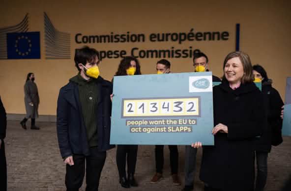 EU Commissioner Věra Jourová (right) accepts the petition