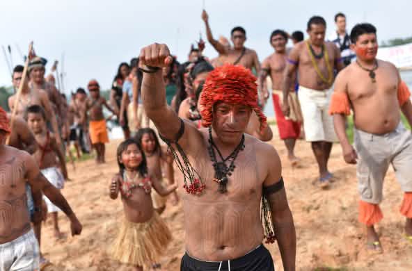 Indigenous Mundurukú people protesting the planned construction of a dam on the Tapajos river in Brazil