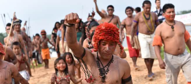 Indigenous Mundurukú people protesting the planned construction of a dam on the Tapajos river in Brazil
