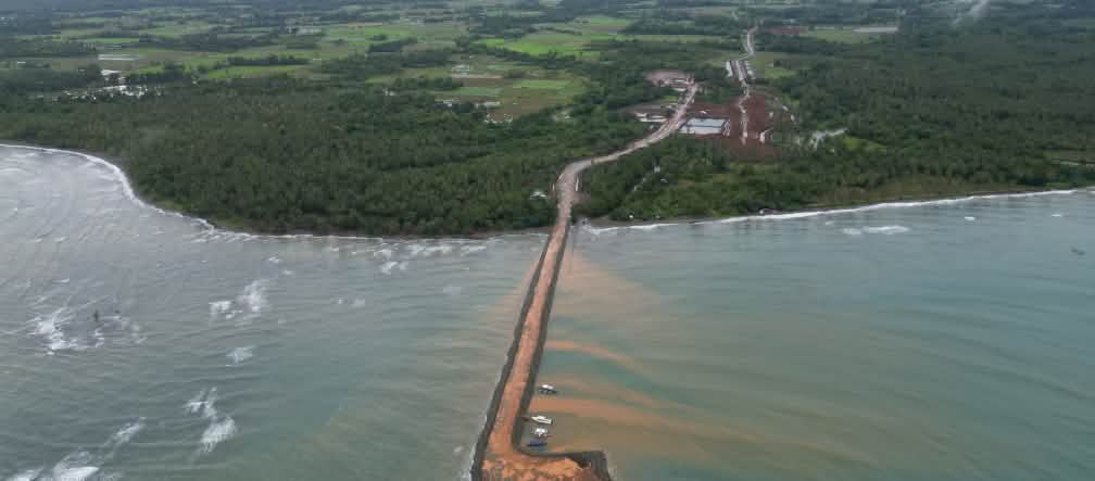 Brooke's Point: Nickel ore is shipped from this jetty by Ipilan Nickel Corporation (INC) A brown jetty leads from the nickel mine in the rainforest out to sea. Aerial view