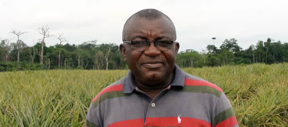 Odey Oyama is fighting pineapple plantations in the Cross River National Park. Odey Oyama in front of a pineapple plantation