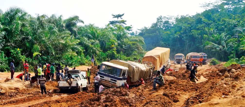 ...often under challenging conditions. Trucks stuck in mud, Liberia