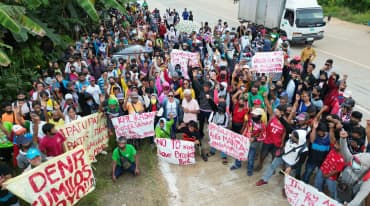 Residents of Brooke’s Point form a human barricade in front of Ipilan Nickel Corporation’s mining site