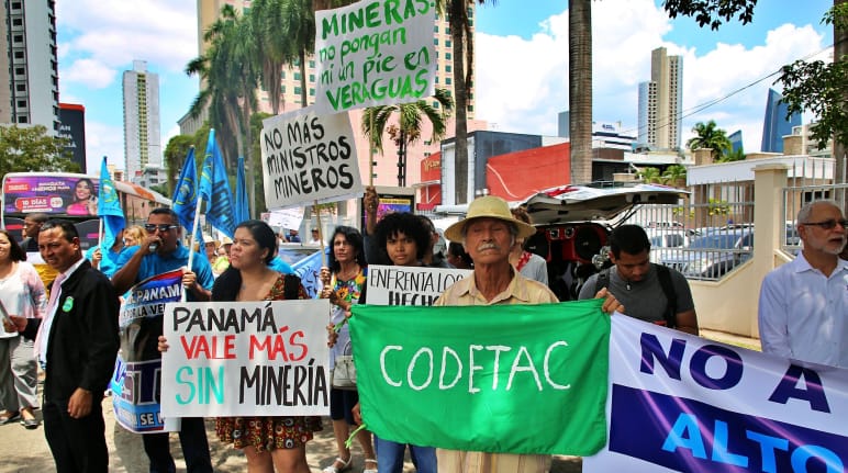 Panama City: people with hand-painted banners protesting against mining