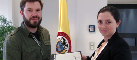 David Vollrath from Rainforest Rescue hands over the signatures to the diplomatic secretary